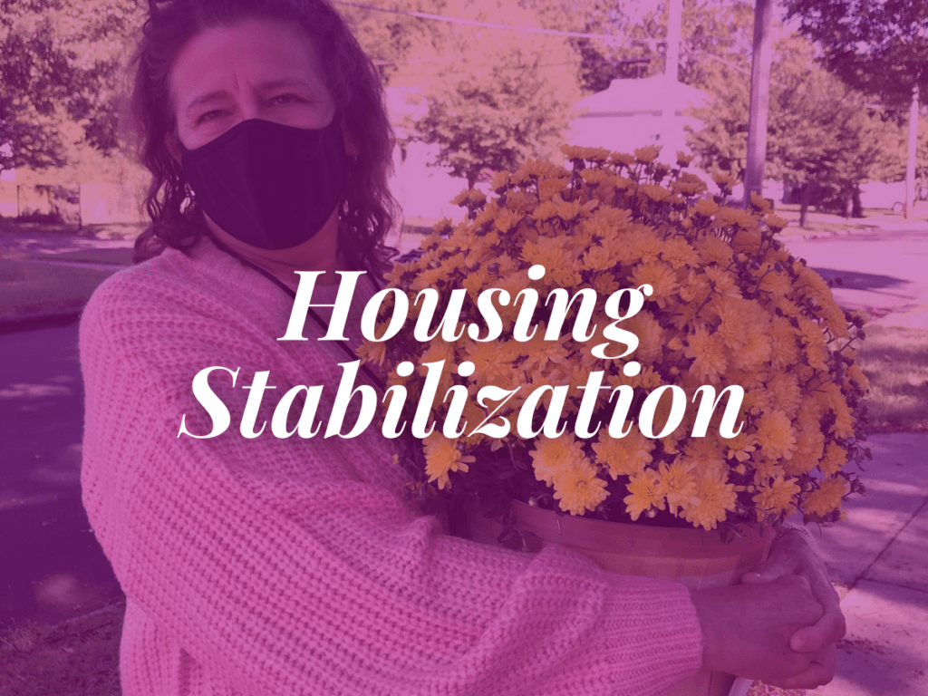 room in the inn blog title housing stabilization overlays image of woman holding basket of mum flowers